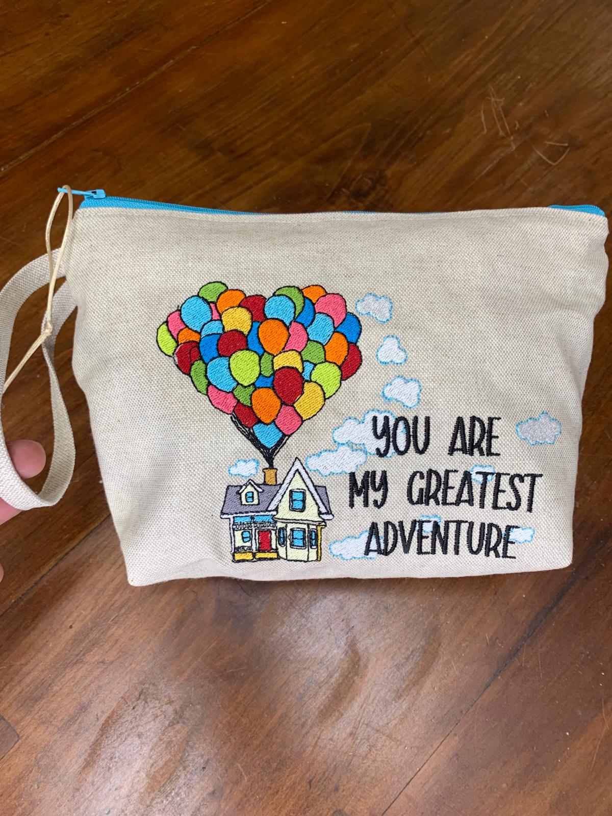 Maxi pochette trapezio ricamata "you are my greatest adventure"