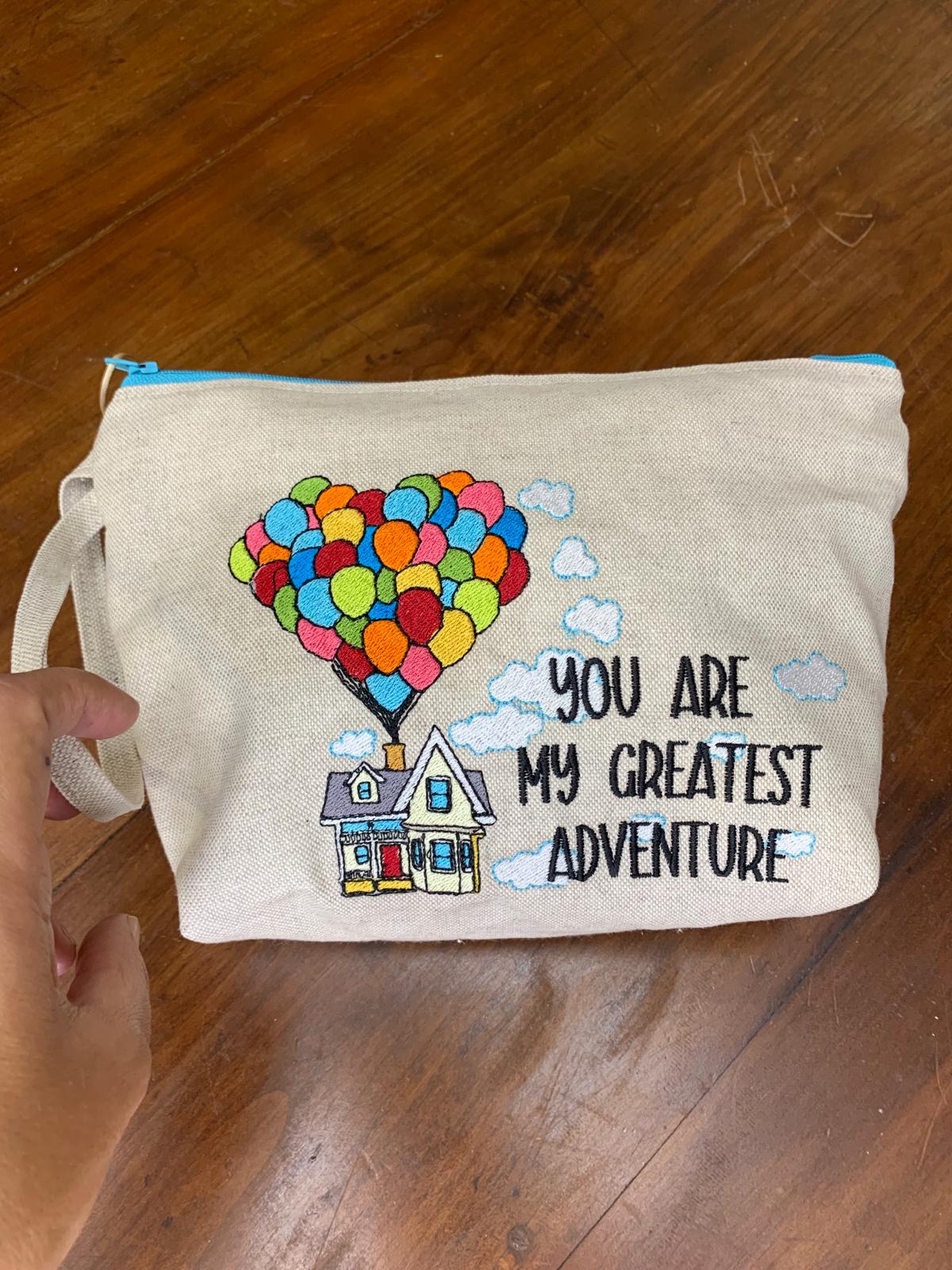 Maxi pochette trapezio ricamata "you are my greatest adventure"